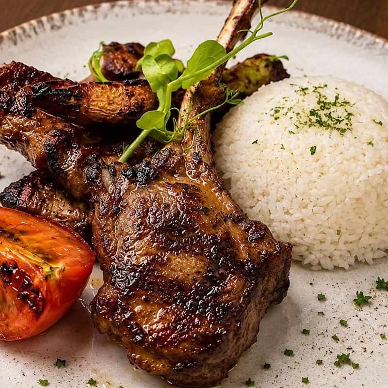 Lamb chops from the charcoal grill, thoughtfully plated at SoBha